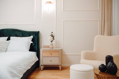 Stylish and cozy bedroom with bedding and modern furniture