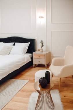 Interior of comfortable modern and stylish bedroom. Luxury interior design in modern apartmen