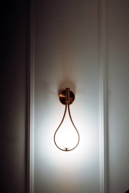 Close up details of elegant light fixtures in modern city designer apartment