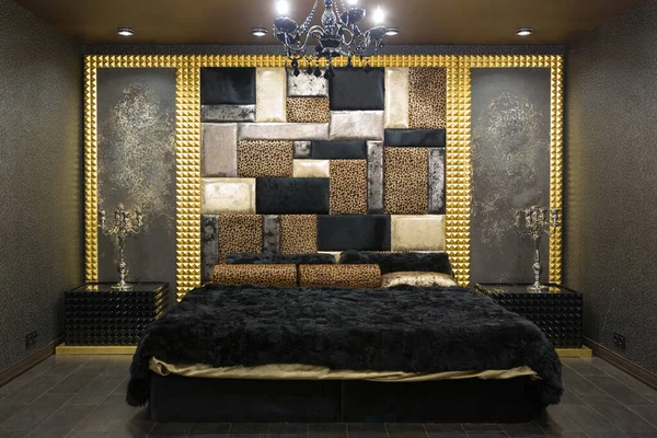 Stock image luxurious romantic room in a pompous style in black and gold colors with magnificent furniture