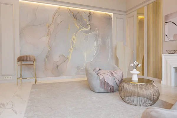 the latest fashion home trends in an ultra modern elegant interior of a cozy studio in soft pastel colors. close-ups of a stylish living area with golden elements