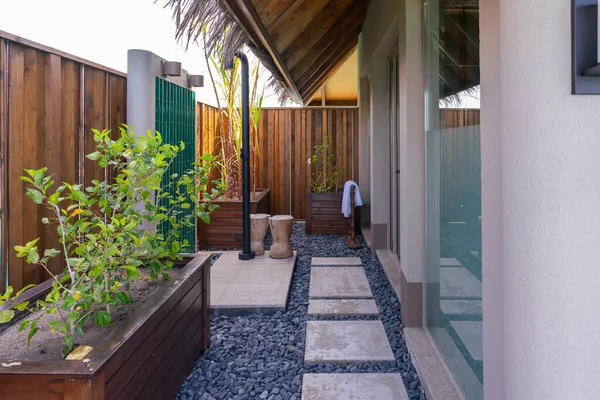 stock image Luxurious exterior of a very expensive rich water villa in the Maldives, decorated with natural wood.