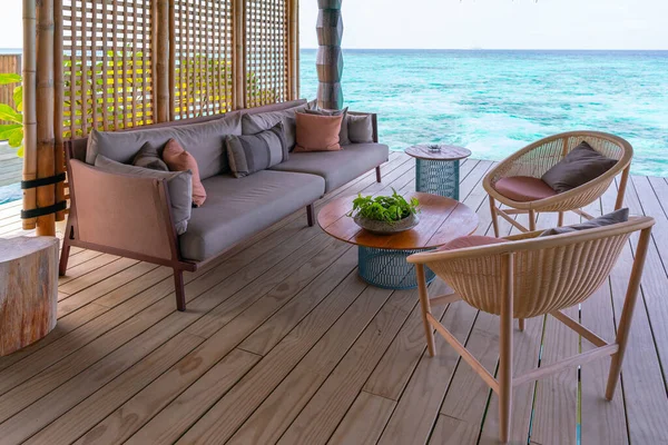 Stock image Luxurious exterior of a very expensive rich water villa in the Maldives, decorated with natural wood.