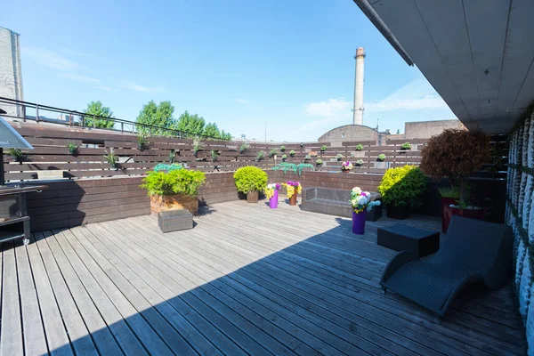 stock image The modern design of the outdoor terrace is decorated with wood and living plants