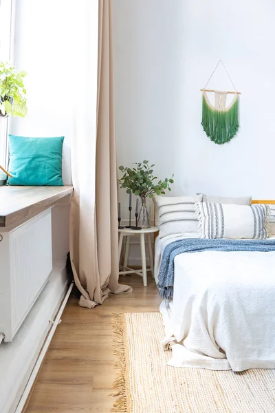 stock image interior of stylish loft. spacious apartment with large windows, parquet on the floor and light walls. closeup view of shelving with different small things for decoration