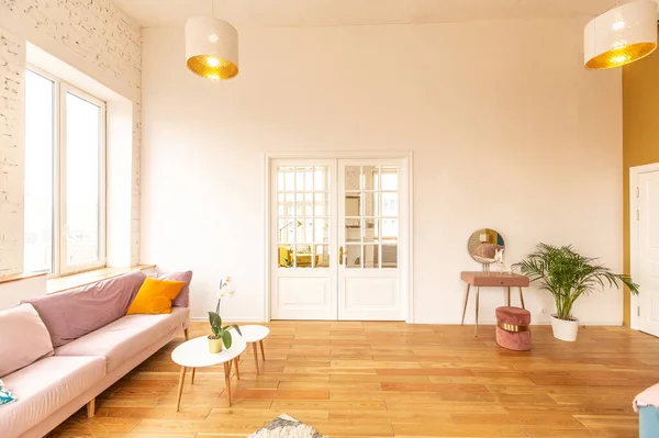 very light and spacious two-rooms apartment in Scandinavian design style with fashion furniture and large windows. warm colors during day time