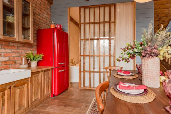 stock image cozy all wooden interior of a country house in a wooden design. spacious living room with kitchen area with large windows. bedroom on the second floor.