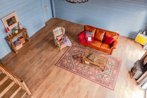 stock image cozy all wooden interior of a country house in a wooden design. spacious living room with kitchen area with large windows. bedroom on the second floor.