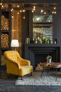 dark brutal interior of sitting room decorated with wooden logs. yellow and grey soft armchairs, huge arc window and fireplace clipart