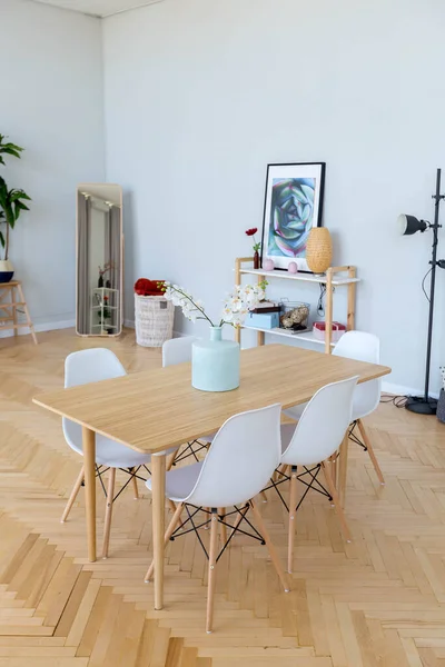 The interior design of the studio apartment in Scandinavian style. A spacious huge room in light colors. stylish expensive luxury furniture.