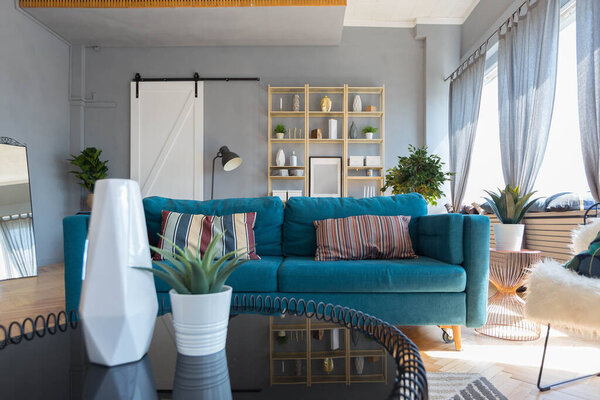 elegant creative modern trendy interior of a spacious open plan Scandinavian style studio with seating and sleeping areas