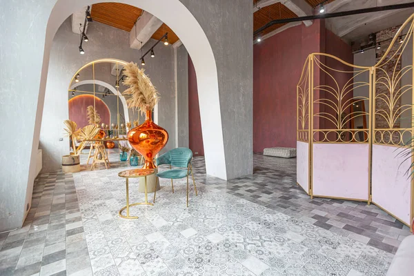 stock image interior of a large apartment in oriental mixed with loft style with arches, led lighting and bright orange elements