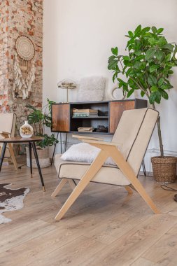 Bright and spacious living area featuring modern furniture and natural light in a stylish apartment in soft warm colors clipart