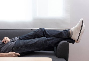 man sitting on the sofa in the room