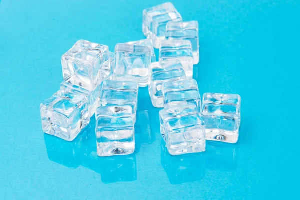 Ice cubes on blue background, Cubes of ice on a light blue background, Flat lay, top view