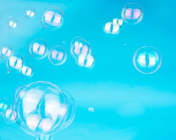 Stock image Soap bubbles on blue background blured selective