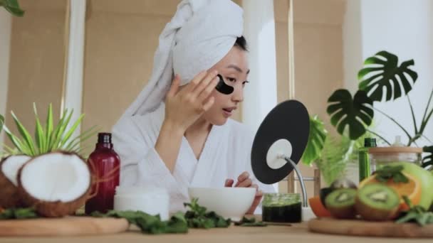 Asian Woman Sitting Table White Towel Bathrobe Looking Mirror Applying — Stock Video