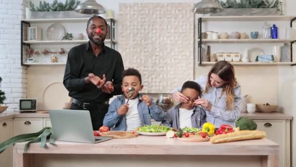 Funny Young Multiracial Family Preparing Salad Fresh Vegetables Handsome African — Vídeos de Stock