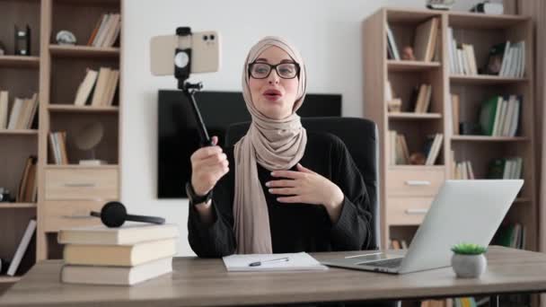 Charming Muslim Woman Hijab Talking Gesturing While Recording Video Modern — Vídeo de Stock