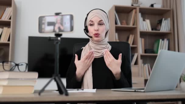 Charming Muslim Woman Hijab Headset Talking Gesturing While Recording Video — Stock Video