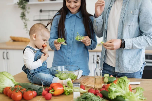 Cropped View Happy Mother Smiling Baby Daughter Eating Crunchy Vegetable — Stock Photo, Image