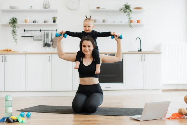 Joyful Woman Yoga Clothing Carrying Baby Girl Dumbbells Shoulders While — Stock Photo, Image
