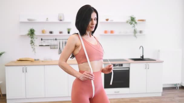 Portrait Skinny Woman Terracotta Gym Clothes Wearing Measuring Tape Neck — Stock Video