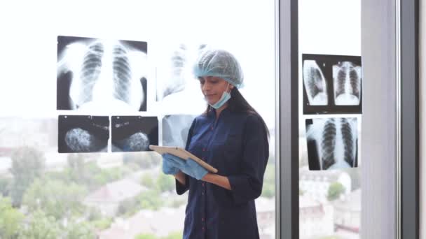 Confident Indian Woman Wearing Medical Gloves Cap Holding Digital Tablet — Stock Video