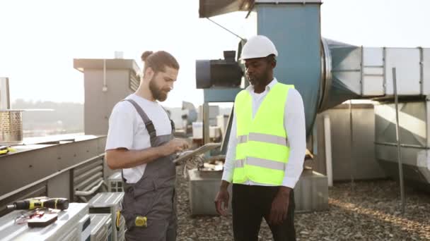 Serious Engineers Standing Shaking Hands While Working Together Roof Multicultural — Stock Video