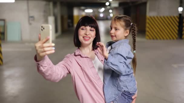 Caucasian Mother Holding Preschool Daughter Hands Making Selfie Smartphone Underground — Stock Video