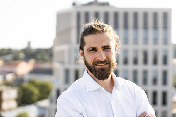 Confident Young Man Beard Standing Urban Setting Wearing White Shirt Stock Image