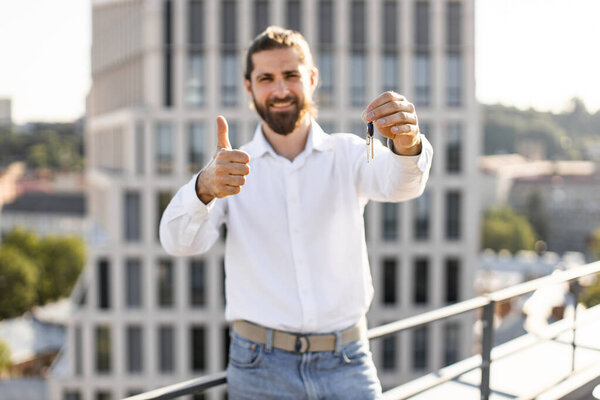 Happy Man Standing Rooftop Holding Keys Giving Thumbs Concept Success Stock Picture