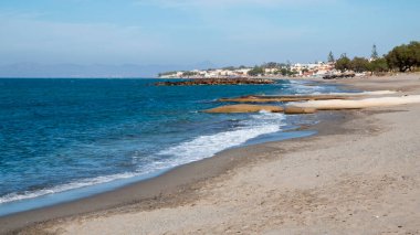 The beach at Platanias, Crete on a sunny day clipart