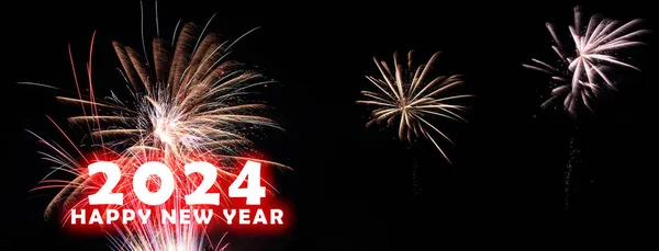 A banner with 2024 Happy New Year with fireworks on a black background.