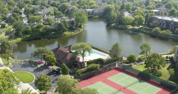 Aerial View Suburban Community Tennis Courts Pool Lake — Vídeos de Stock