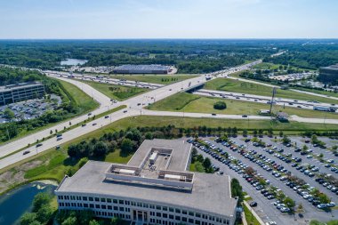 Aerial view of an suburban office park with at a highway interchange.