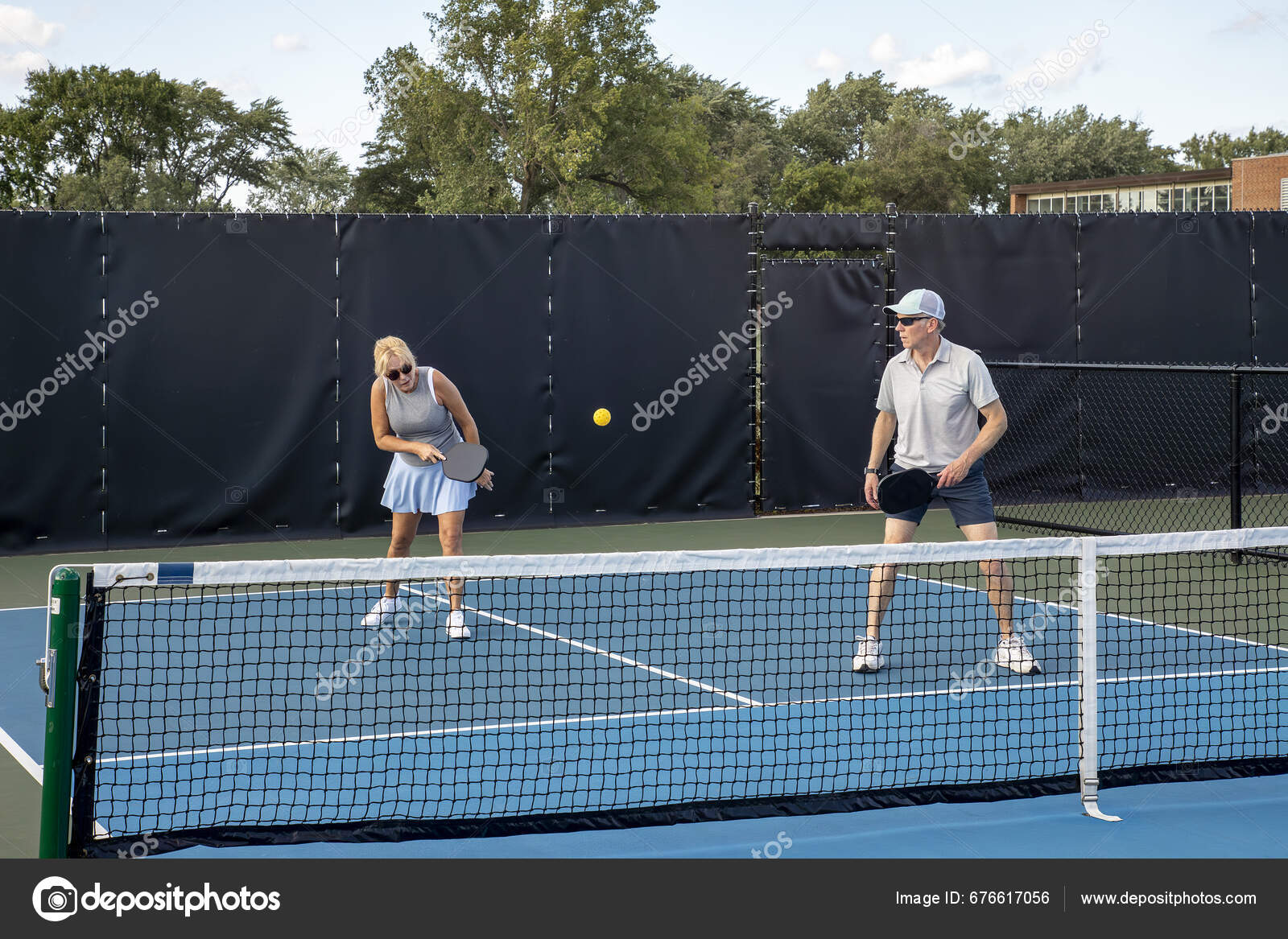 Female Pickleball Player Returns Shot Her Male Partner Stands Net Stock