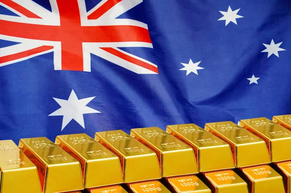 Reihe Goldglänzender Goldbarren Auf Dem Hintergrund Der Australischen Flagge Geschäfts lizenzfreie Stockfotos