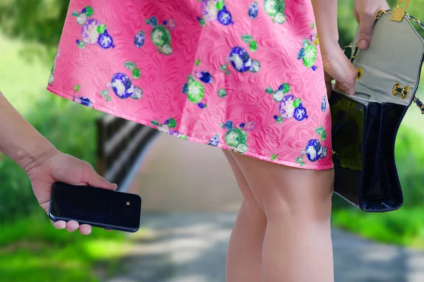 Man Takes Photo Smartphone Woman Ass Her Skirt Sexual Harassment Imagen de stock