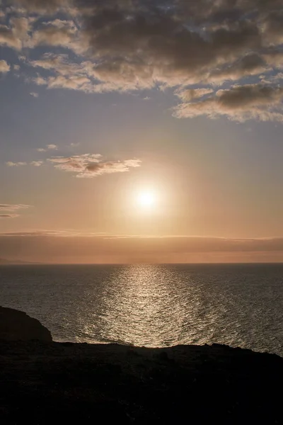 golden hour on the west coast of Fuerteventura, view of the sunset mood over the open sea in the beautiful evening light