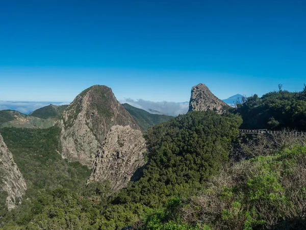 Stock image Scenic view from the Mirador del Bailadero with volcanic rock formations Los Roques and island Tenerife and Volcano Pico de Teide. Garajonay National Park on La Gomera, Canary Islands, Spain, Europe..