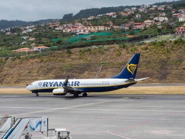 unchal, Madeira, Portugal, May 26, 2022: Passenger plane RYANAIR airline.Aircraft Boeing 737 landed on runway at Madeira International Airport Cristiano Ronaldo, Aeroporto de Santa Catarina. clipart