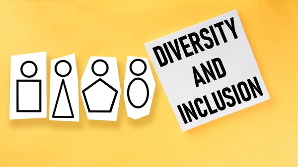 stock image Diversity and inclusion is shown using a text and picture of different people