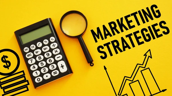 stock image Marketing strategies are shown using a text and photo of calculator