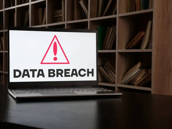 Data breach is shown using a text and picture of sign of alarm