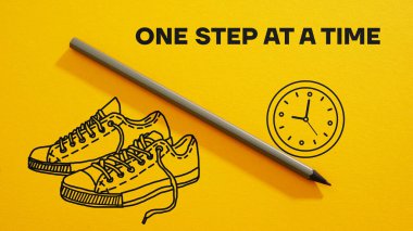 One step at a time is shown using a text and pictures of sneakers and clock
