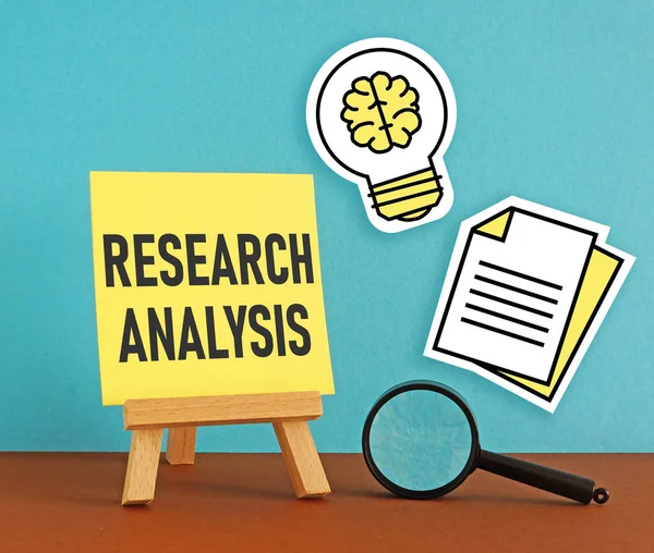 stock image Research analysis concepts are shown using a text and photo of magnifying glass