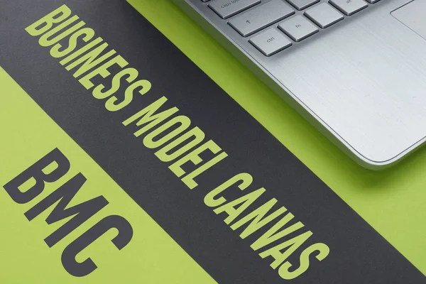 Business model canvas BMC is shown using the text and photo of laptop