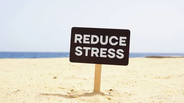Reduce stress is shown using a text and sea beach on the background