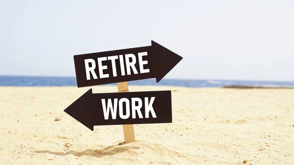Work or Retire signpost in a sea beach background. Two way street road sign pointing to Work and Retire.